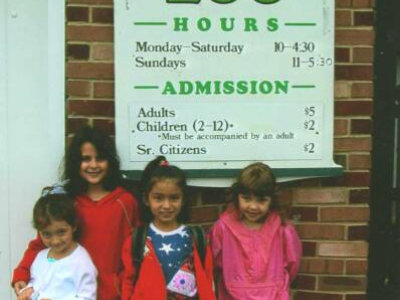 kids smiling at the zoo